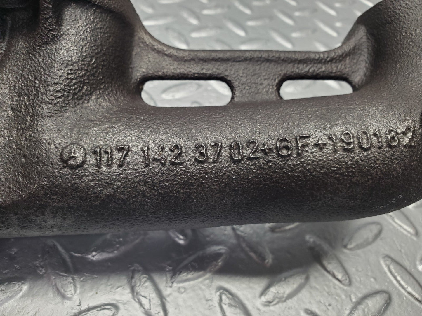 W126 Coupe exhaust manifold left used OEM