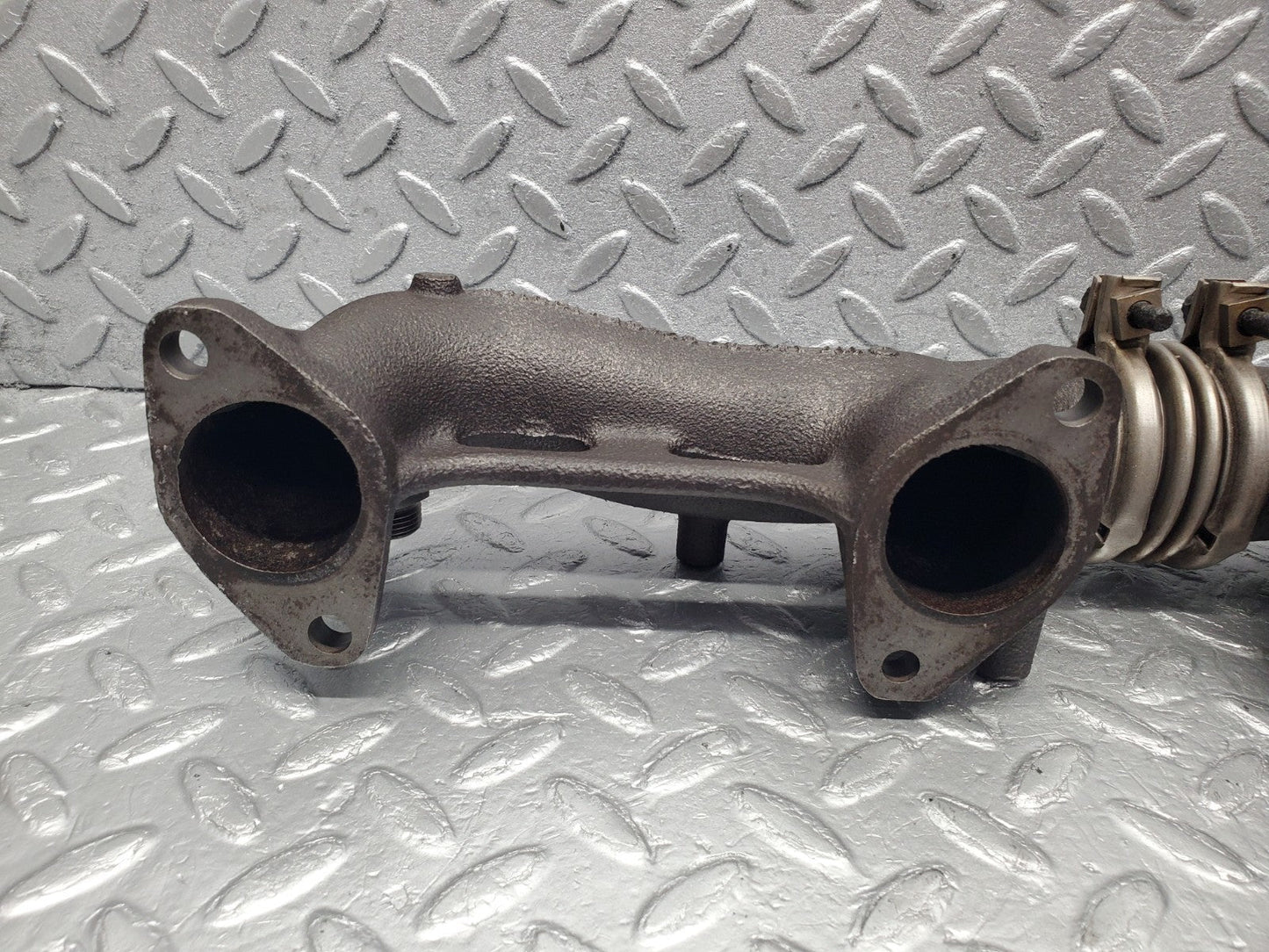 W126 Coupe exhaust manifold left used OEM