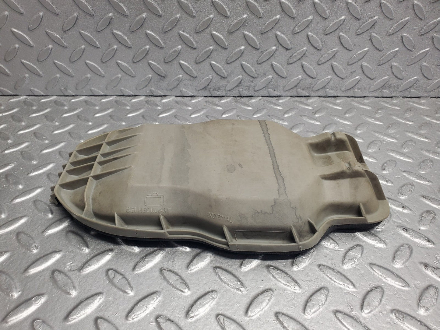 W123 headlight bulb cover left side used OEM