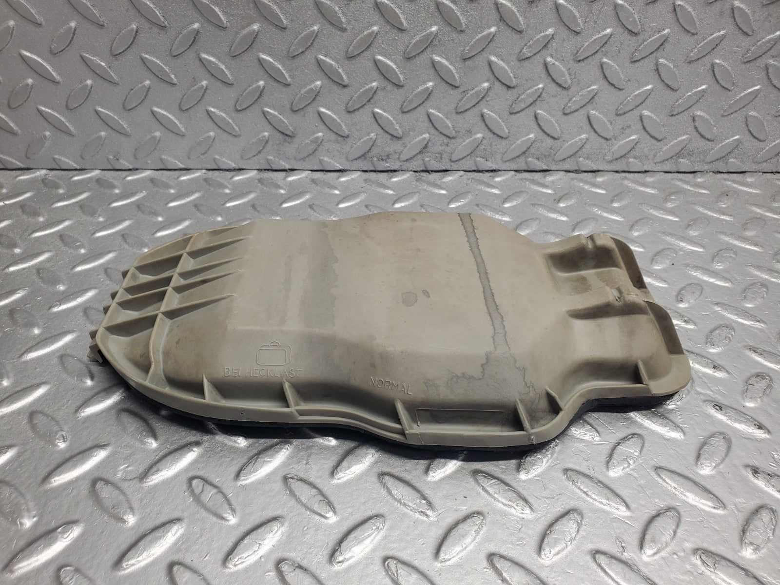 W123 headlight bulb cover left side used OEM