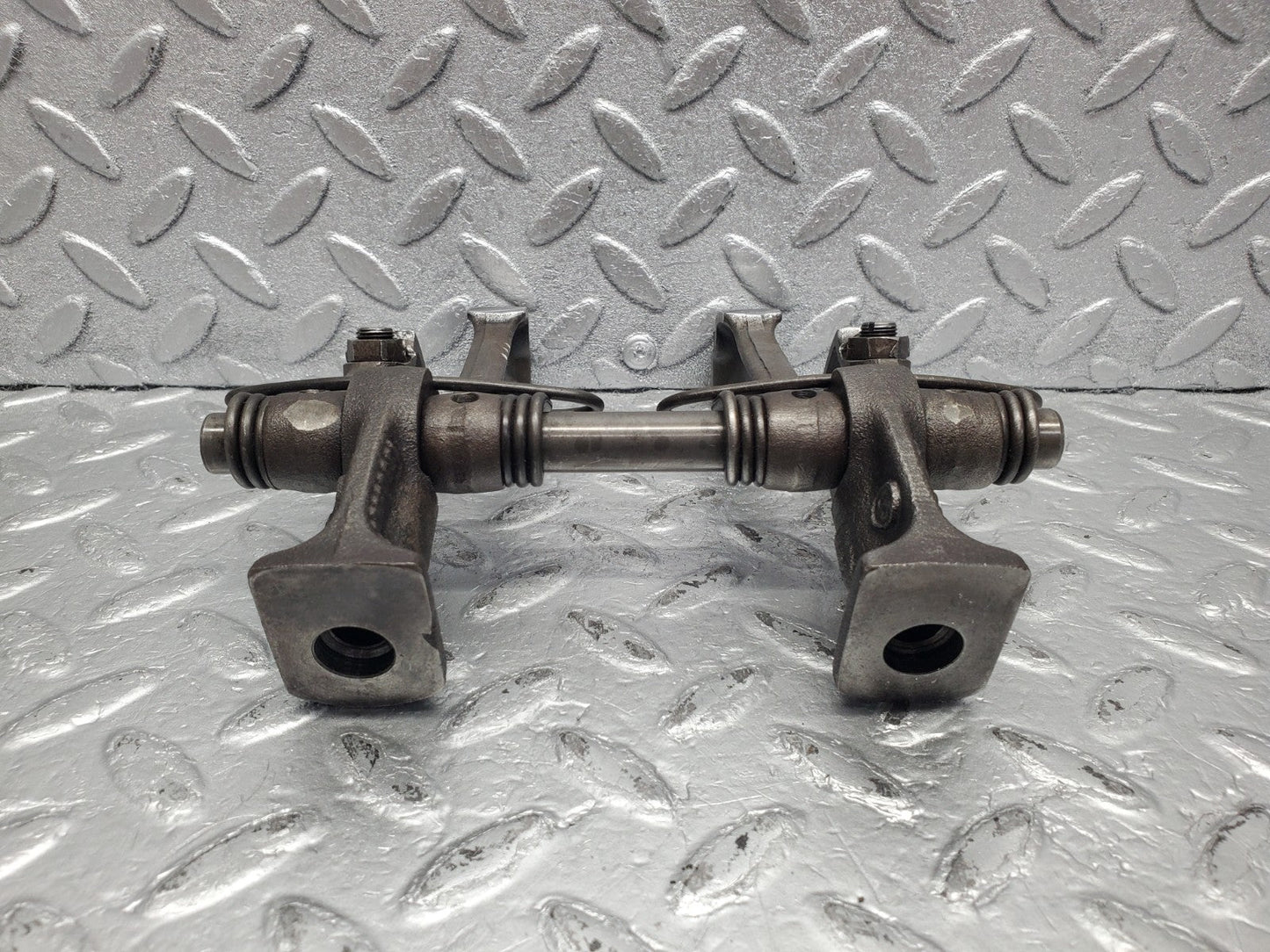 W112 rocker arm support with arm and shaft used OEM