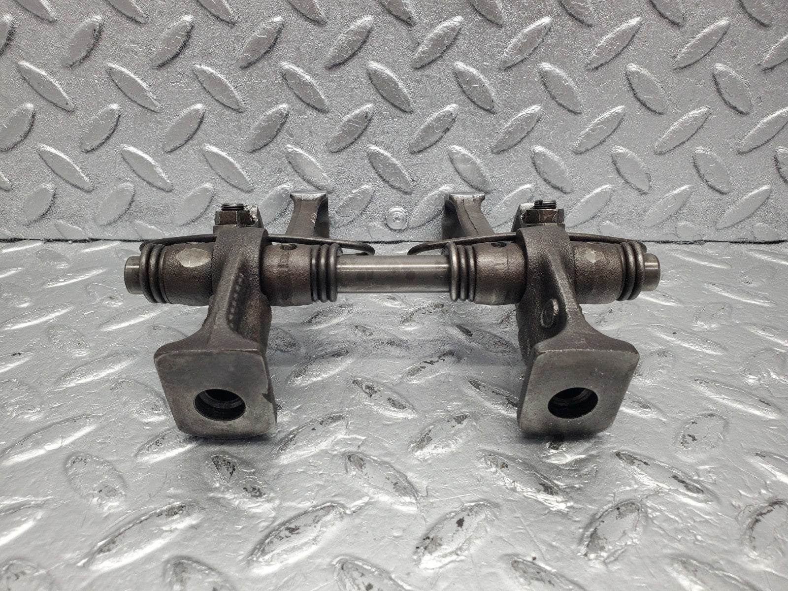 W112 rocker arm support with arm and shaft used OEM