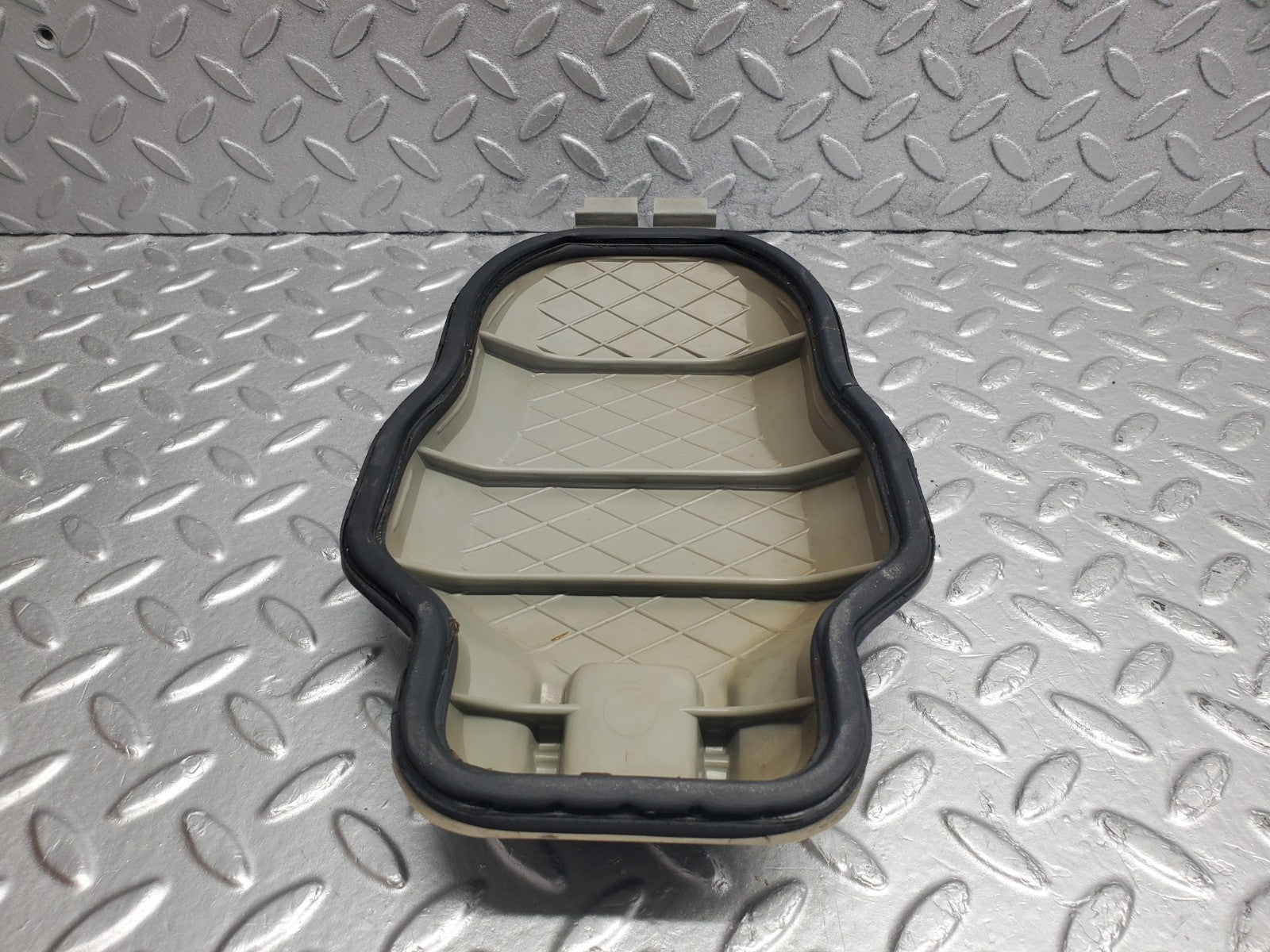 W123 headlight bulb cover left side used OEM