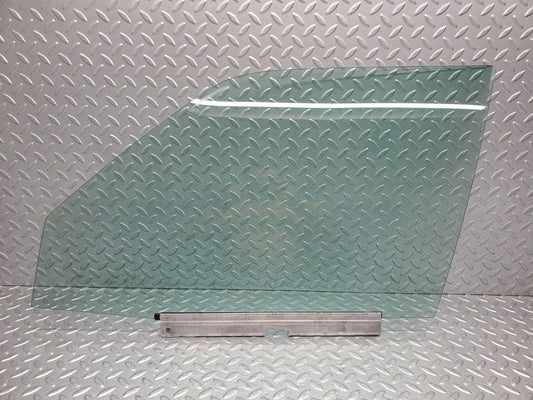 W124 Wagon front left door window glass used OEM