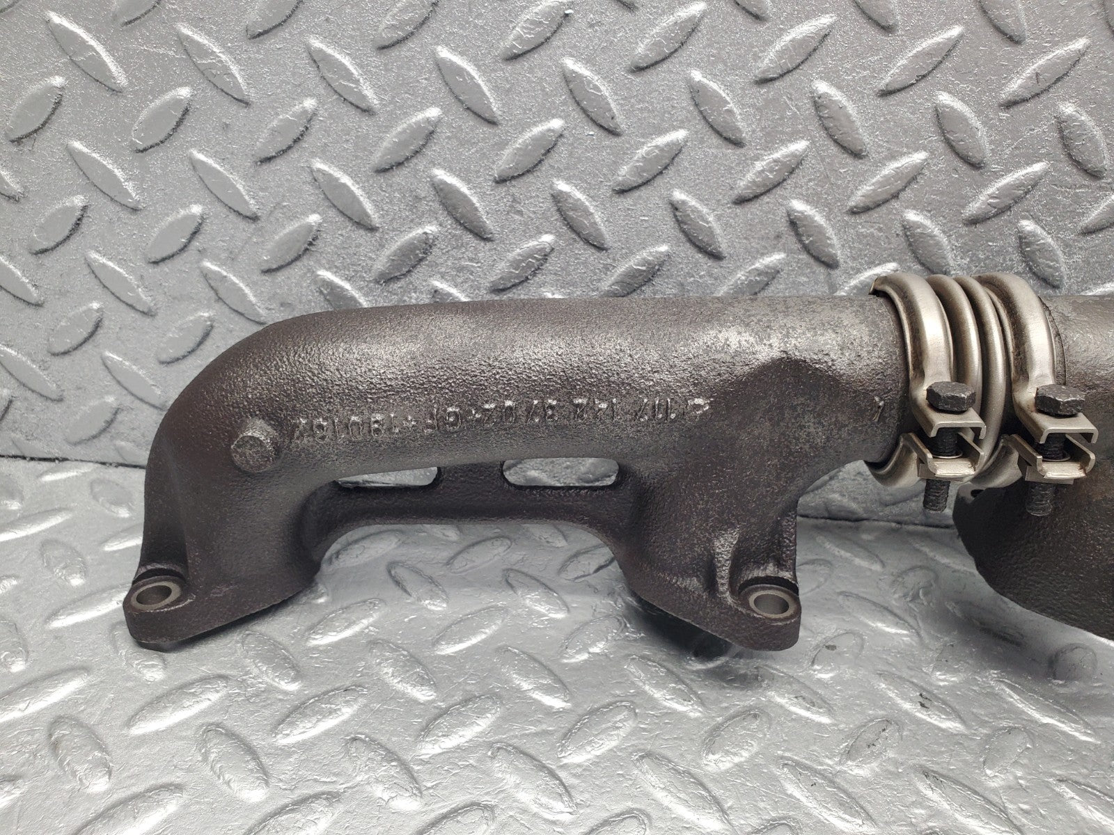 W126 Coupe exhaust manifold left used OEM
