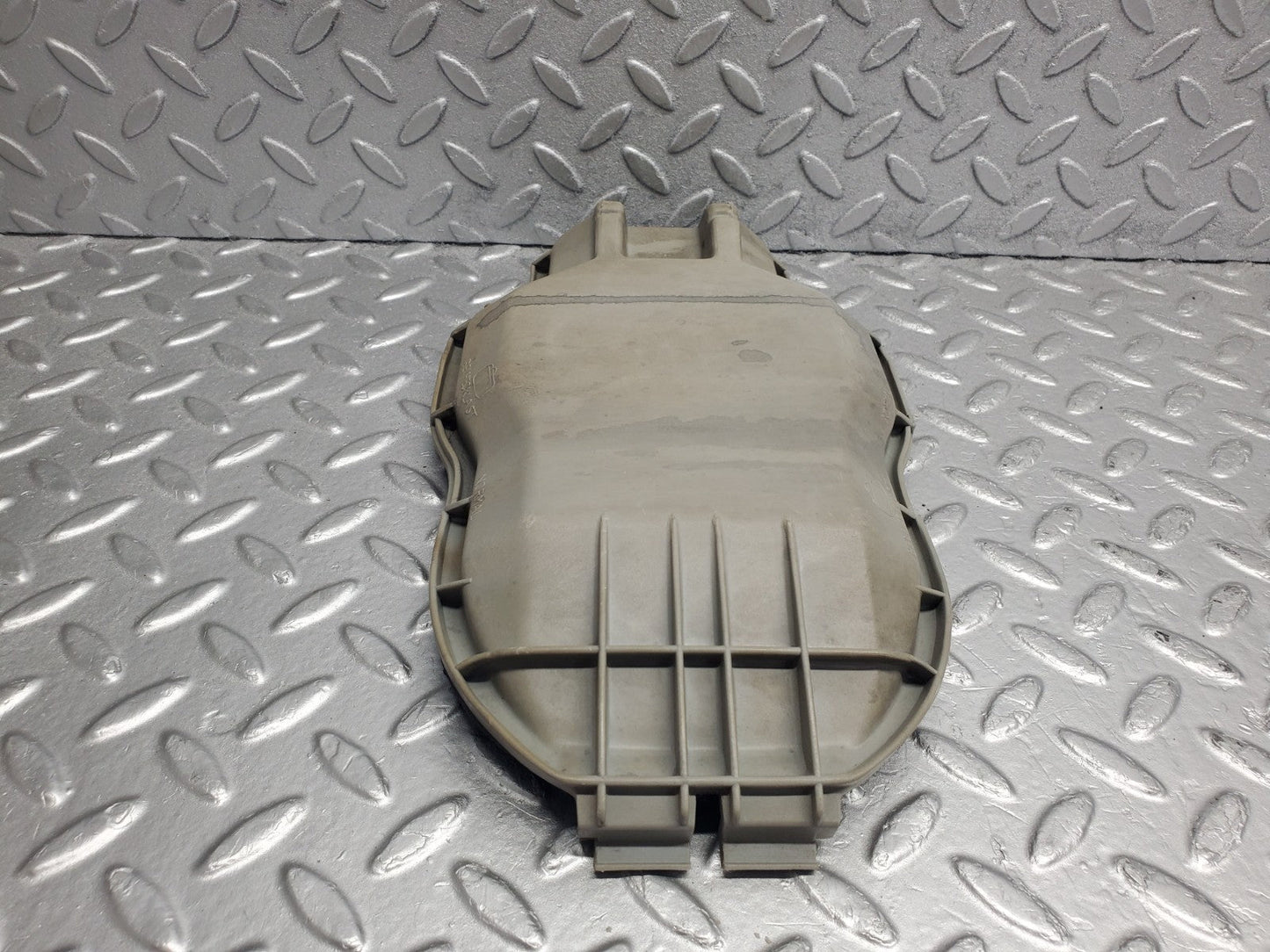 W123 headlight bulb cover left side used OEM