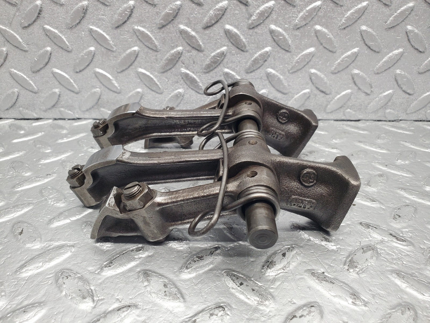 W112 rocker arm support with arm and shaft used OEM