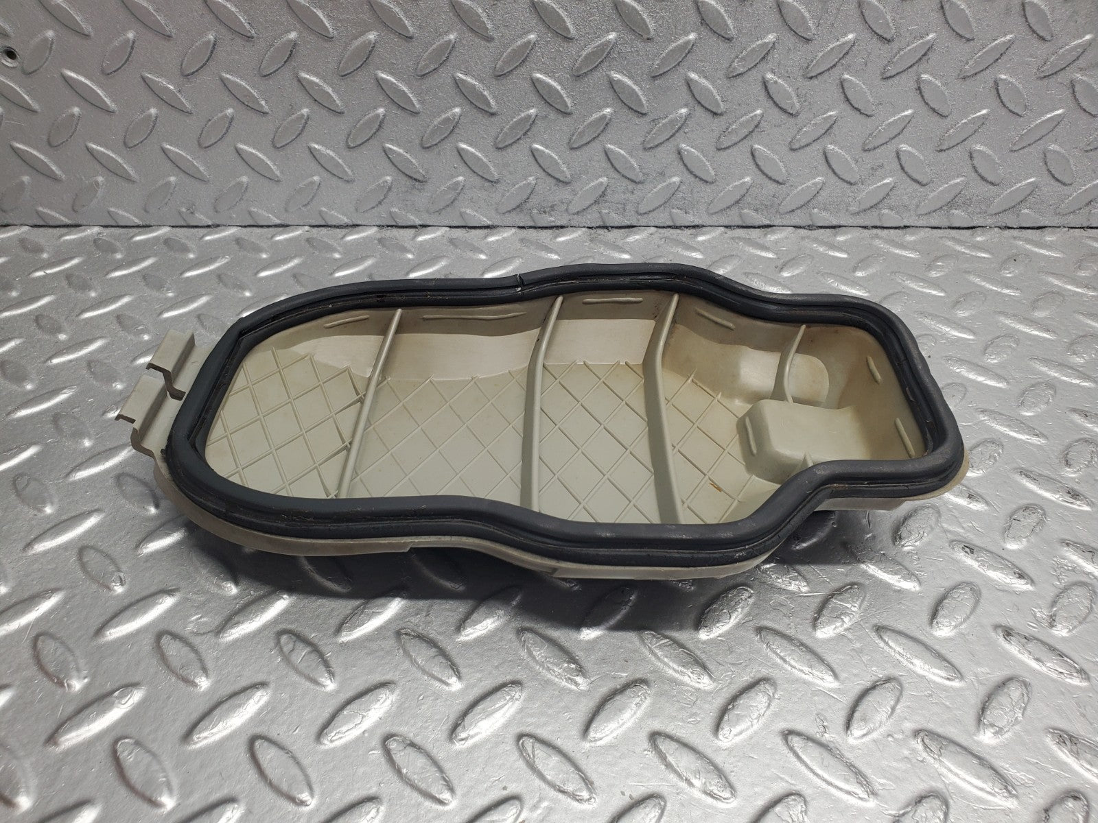 W123 headlight bulb cover left side used OEM