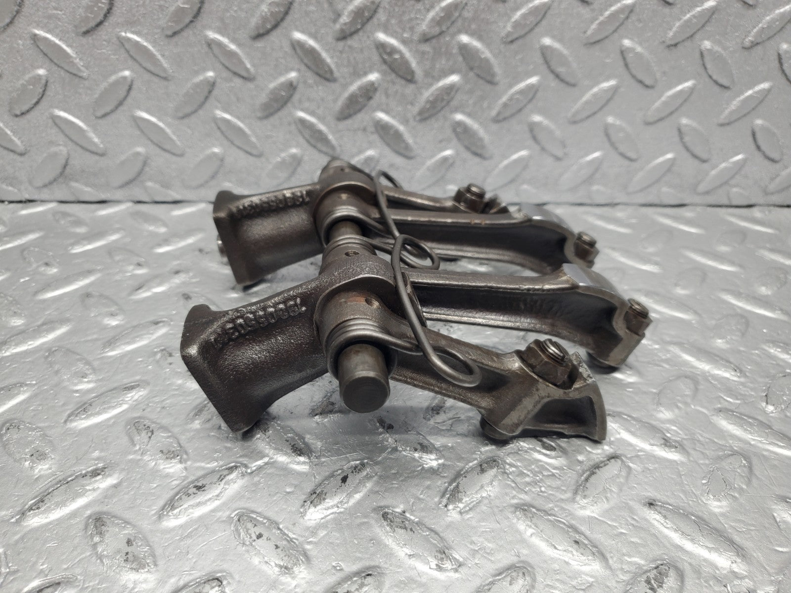 W112 rocker arm support with arm and shaft used OEM