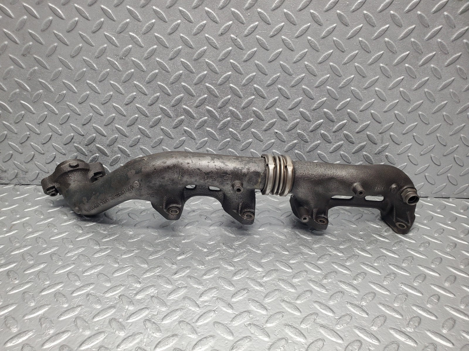 W126 Coupe exhaust manifold left used OEM