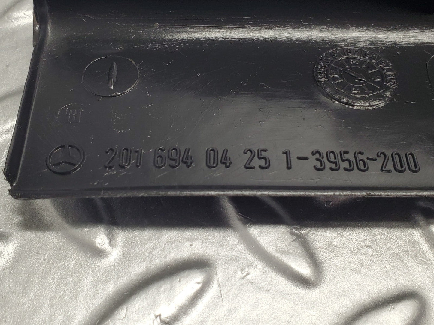 W201 Baby Benz trunk lock trim panel used OEM