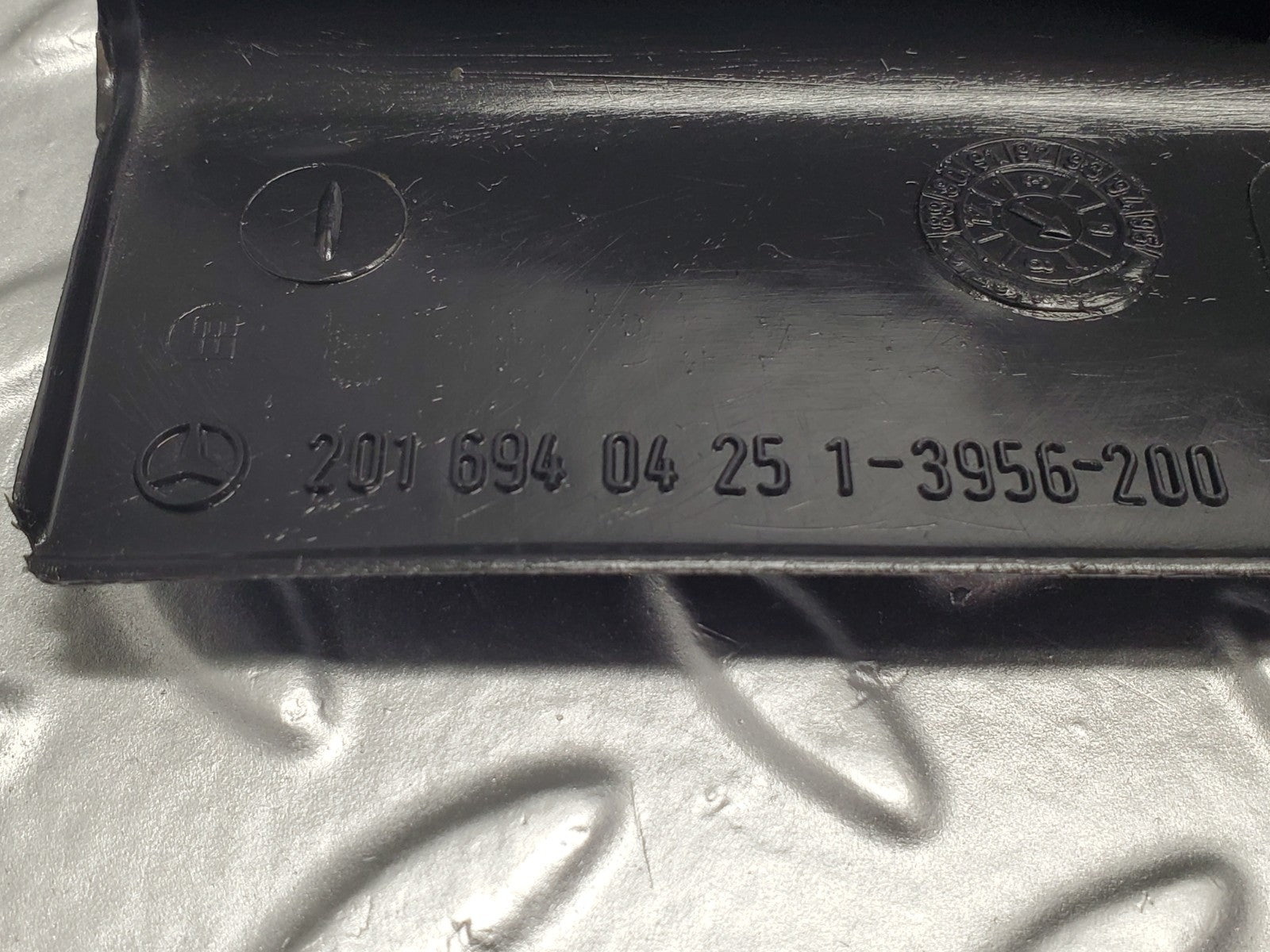 W201 Baby Benz trunk lock trim panel used OEM