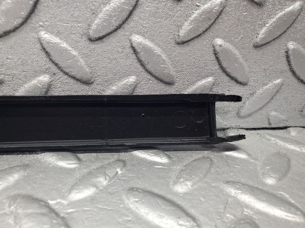 W201 Baby Benz under headlight trim left used OEM