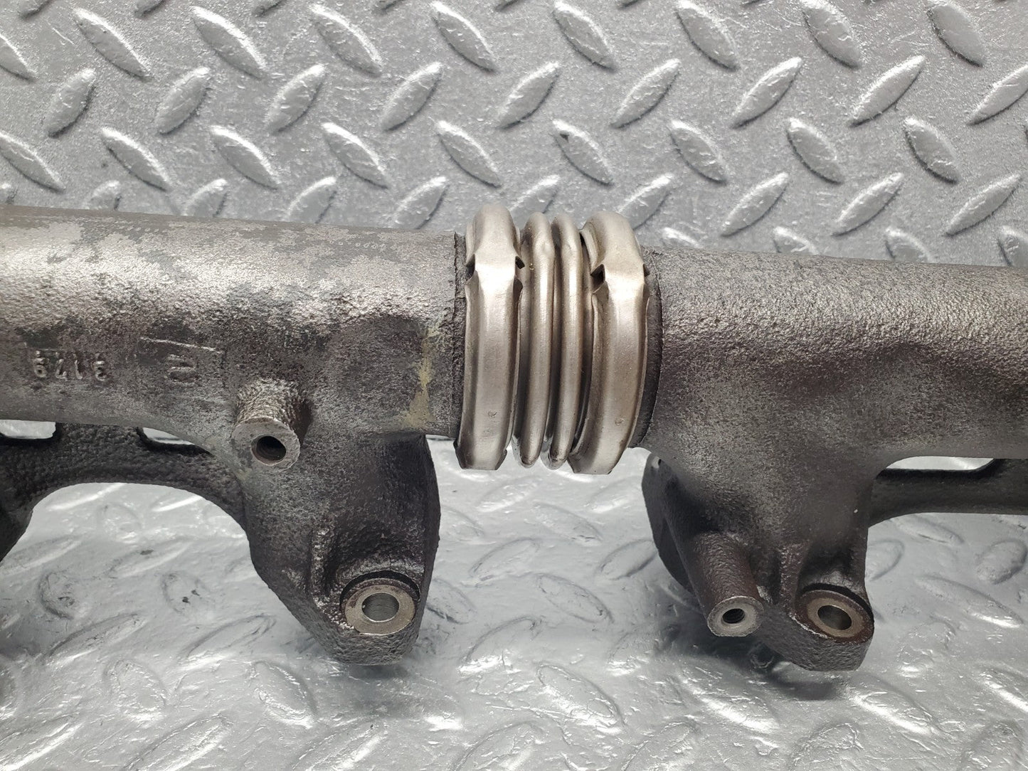 W126 Coupe exhaust manifold left used OEM