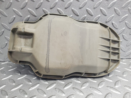 W123 headlight bulb cover left side used OEM