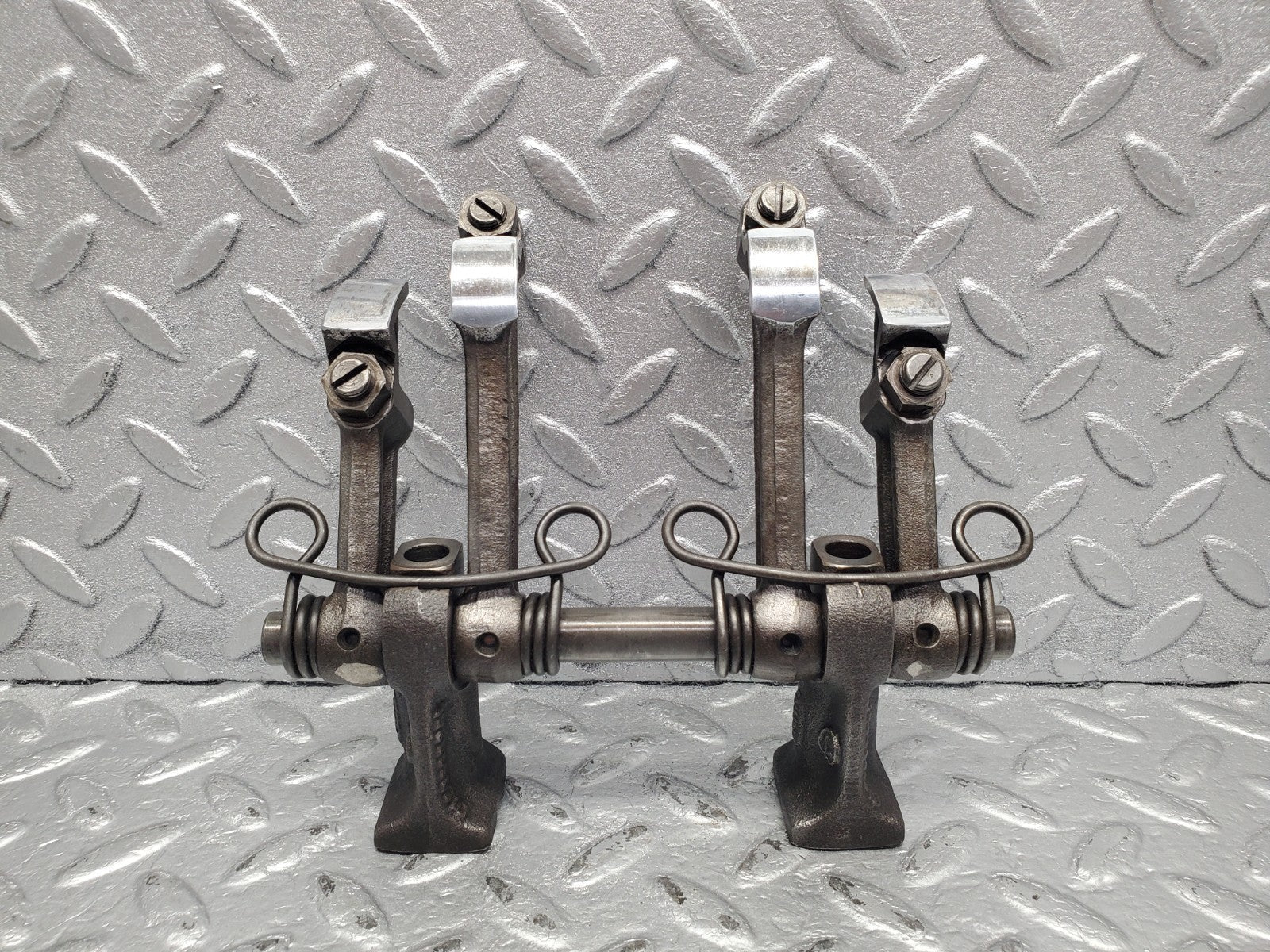 W112 rocker arm support with arm and shaft used OEM