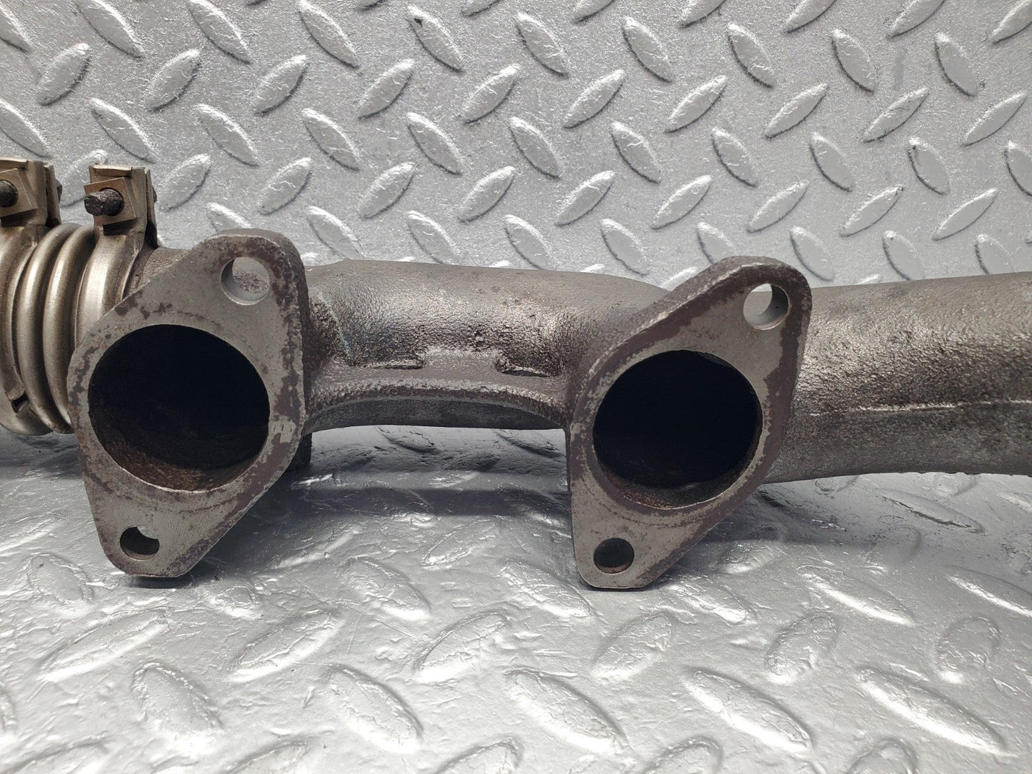 W126 Coupe exhaust manifold left used OEM