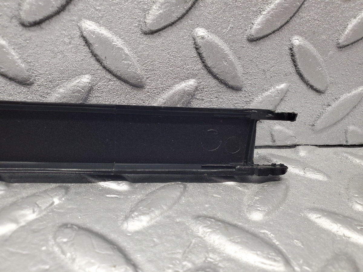 W201 Baby Benz under headlight trim right used OEM