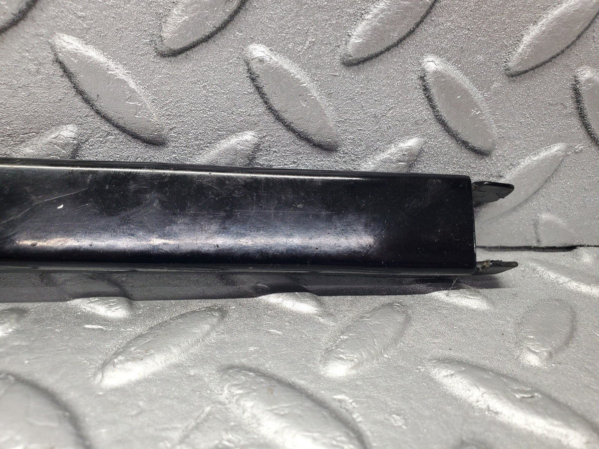 W201 Baby Benz under headlight trim left used OEM