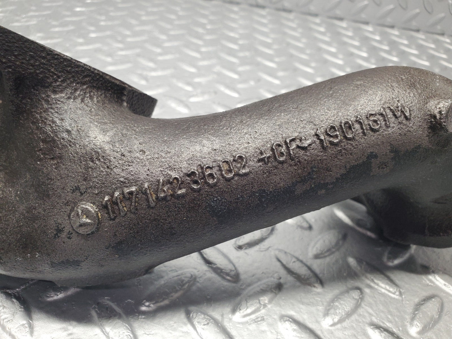 W126 Coupe exhaust manifold left used OEM