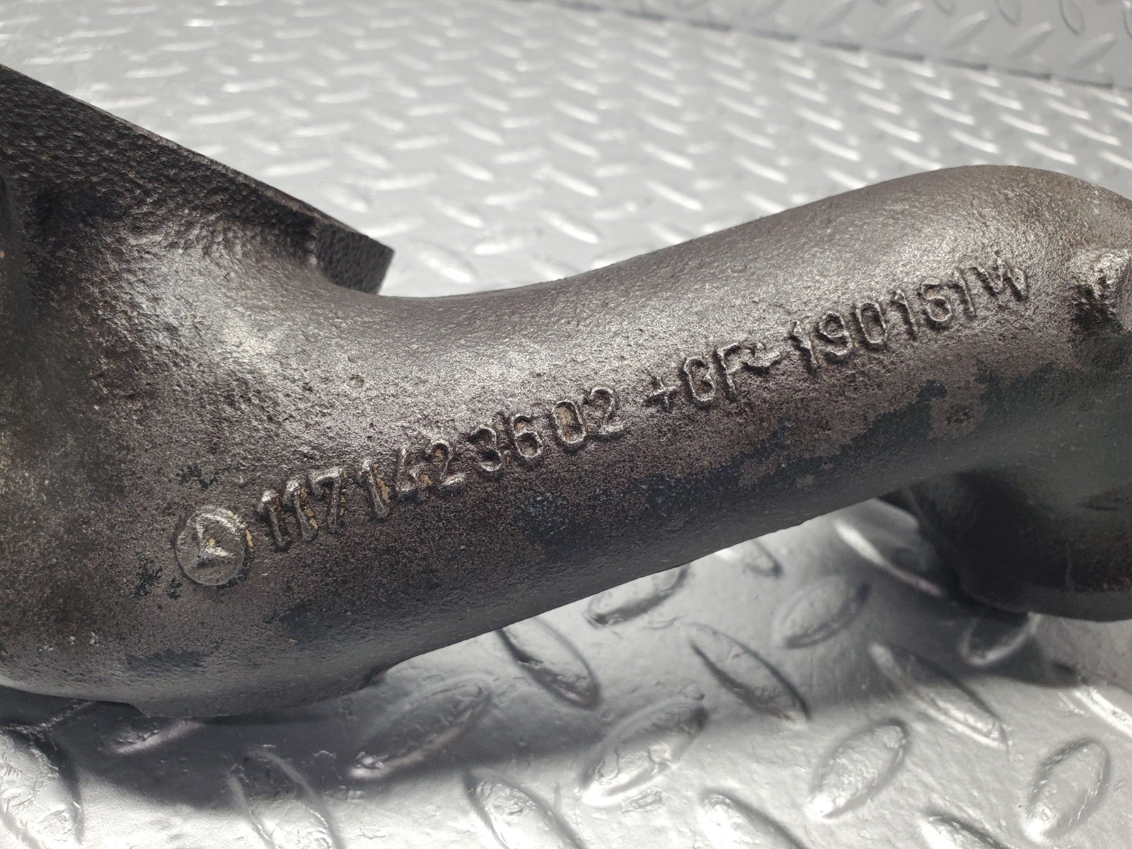 W126 Coupe exhaust manifold left used OEM